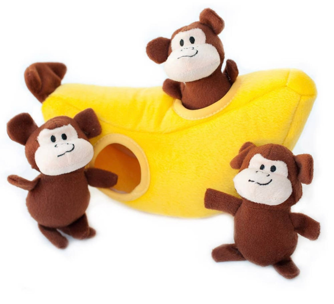 Stuffed toy monkey with banana outlet